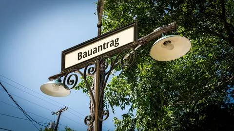 Signposts the direct way to building request Stock Photos