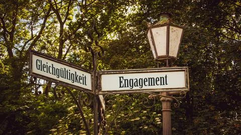 Signposts the direct way to Commitment versus Indifference Stock Photos