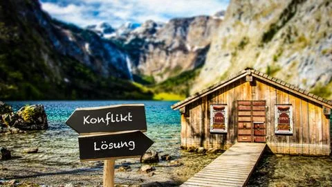Signposts the direct way to conflict versus resolution 스톡 사진