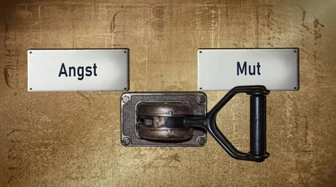 Signposts the direct way to Courage versus Fear - BILDMONTAGE An image wit... 스톡 사진