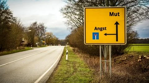 Signposts the direct way to Courage versus Fear 스톡 사진