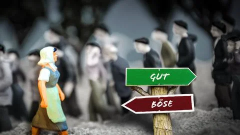 Signposts the direct way to Good versus Evil Foto stock