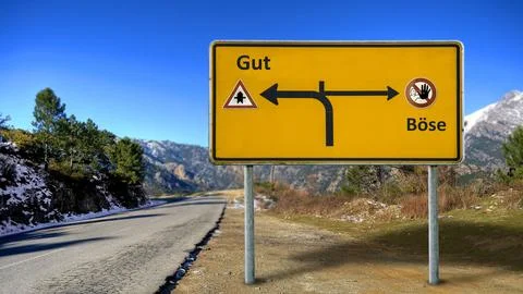 Signposts the direct way to Good versus Evil Foto stock