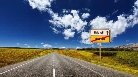 Signposts the direct way to half full versus half empty Stock Photos
