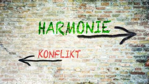 Signposts the direct way to harmony versus conflict Stock-Fotos