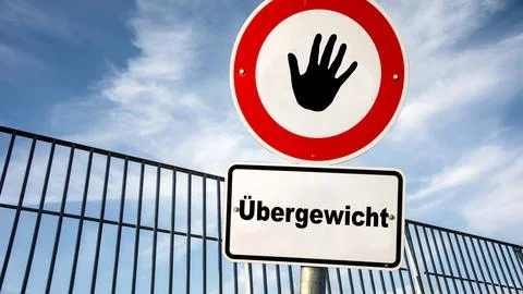 Signposts the direct way to ideal weight versus overweight Stock Photos