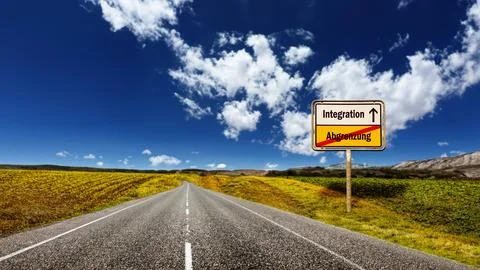 Signposts the direct way to integration versus demarcation Stock Photos