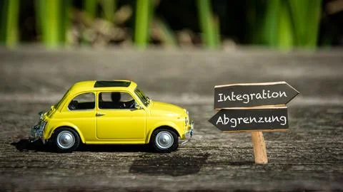 Signposts the direct way to integration versus demarcation Stock Photos