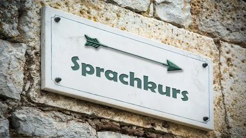Signposts the direct way to Language course Foto stock