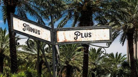Signposts the direct way to plus versus minus Stock Photos