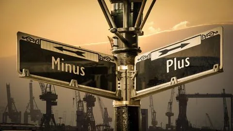 Signposts the direct way to plus versus minus Stock Photos