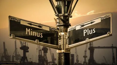 Signposts the direct way to plus versus minus Signposts the direct way to ... Stock Photos