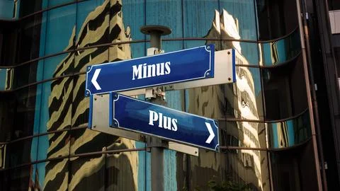 Signposts the direct way to plus versus minus Foto stock