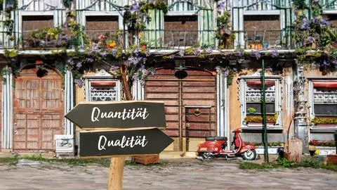 Signposts the direct way to quality versus quantity Stock Photos