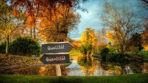 Signposts the direct way to quality versus quantity Stock Photos