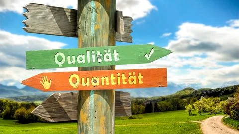 Signposts the direct way to quality versus quantity Stock Photos