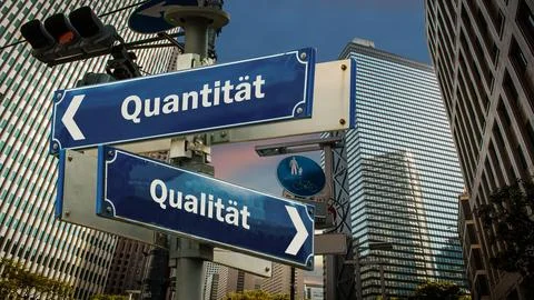 Signposts the direct way to quality versus quantity Stock Photos