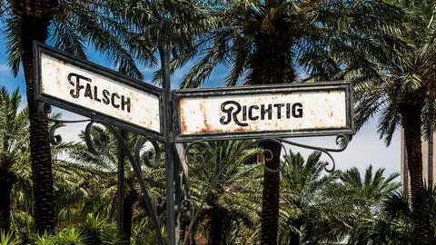 Signposts the direct way to right versus wrong Stock Photos
