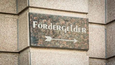 Signposts the direct way to subsidy Stock Photos