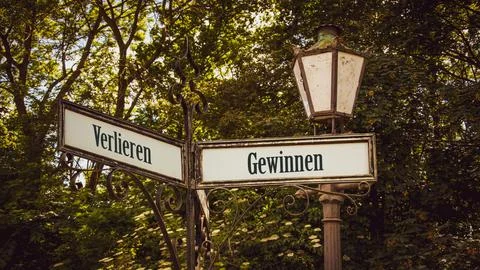 Signposts the direct way to Win versus Loose Stock Photos