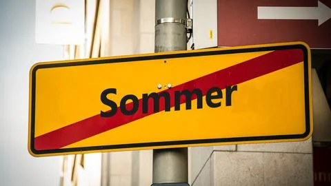 Signposts the direct way to winter versus summer Stock Photos