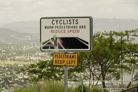 Signs on Side Of Mountain Warning Cyclists To Beware Of Pedestrians Stock Photos