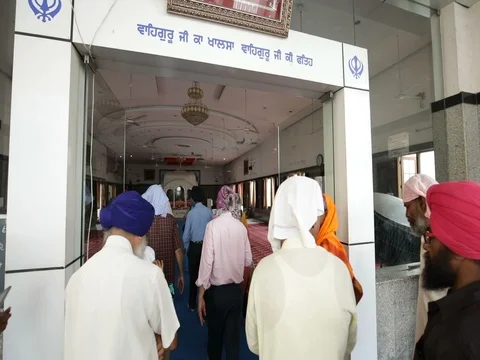 Sikh Indian devotees entering gurudwara temple INDIA Stock Footage 81113223