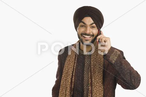 Sikh man talking on a mobile phone Stock Photos