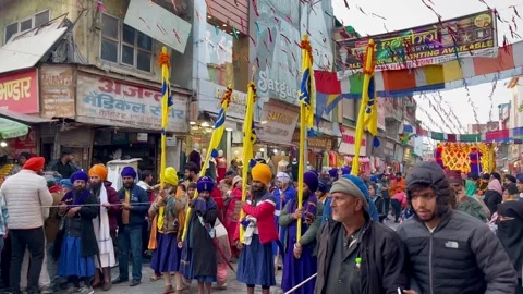 Sikh procession celebrating Guru Gobind Singh Jayanti Stock Footage 299792037