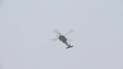 Sikorsky HH-60 Pave Hawk fly mid-air during search and rescue exercise - 2014 Stock Footage 100751353