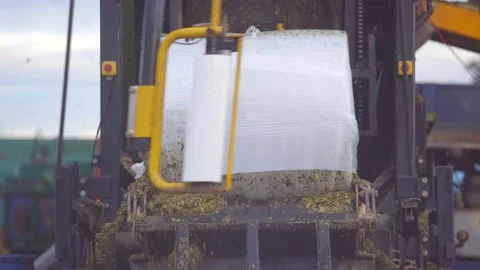Silage making and packing machine in plant Stock Footage 209813810