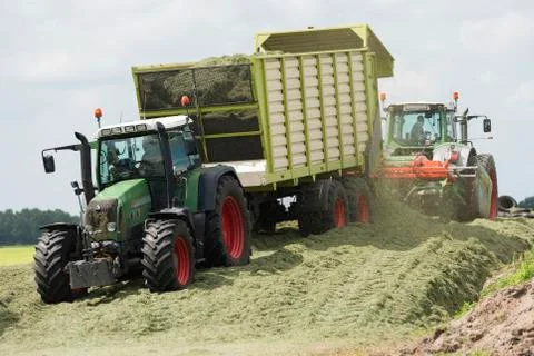 Silage with two tractors Stock Photos