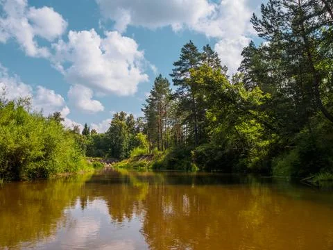 Silence on the river in the middle of the forest. Unique natural locations fa Stock Photos