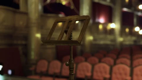 Silent concert hall waiting. Empty stage with focus on brass stand Stock Footage 341568314