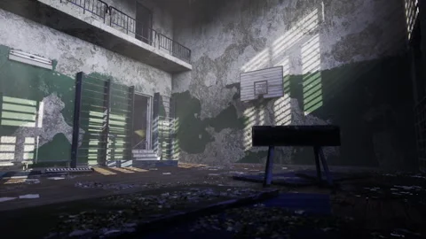Silent deserted gym featuring cracked floors and shadowed windows Stock Footage 339801304