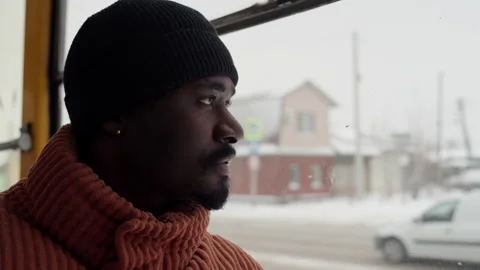 Silent observer views winter landscape from vehicle. Solitary man quietly Stock Footage 345167528
