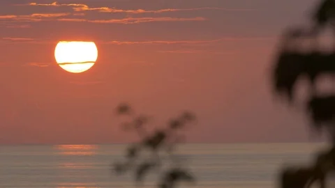 Silent sky with setting sun during dusk over a water body Stock Footage 77559259