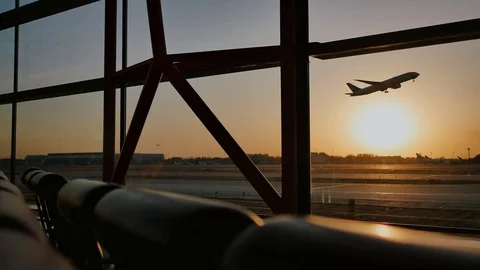 Silhouette of an airplane taking off at sunset at Beijing airport in the Stock Footage 84327942