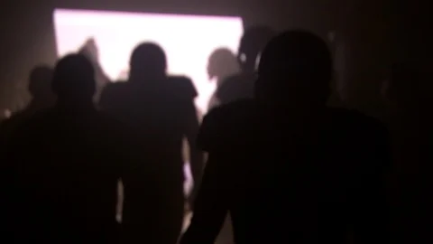 Silhouette of American football players running through tunnel into stadium Stock Footage 104773402