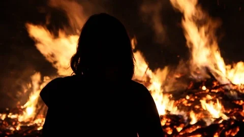 A silhouette and a fire 스톡 동영상 122726998