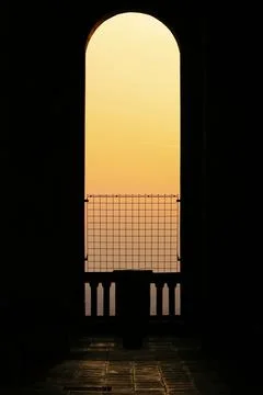 Silhouette of arcade window at sunset Stock Photos
