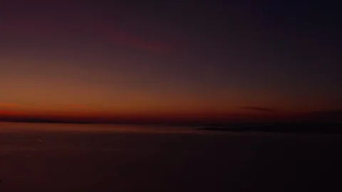 Silhouette of an archipelago with a strong red sunset backdrop Stock Footage