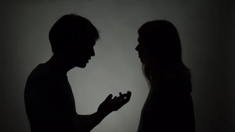 Silhouette of Arguing Couple on Gray Background 库存影片 257468239