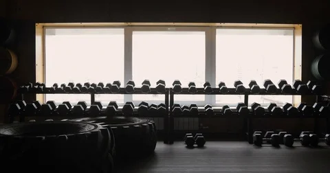 Silhouette of athletic man working out with dumbbells gym black background, man Stock Footage 75870309