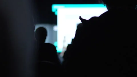 Silhouette Of Audience Watching Presentation At Tech Conference Startup Event Stock Footage 338010113