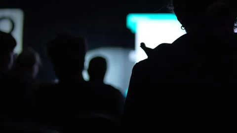 Silhouette Of Audience Watching Presentation At Tech Conference Startup Event Stock Footage 338010405