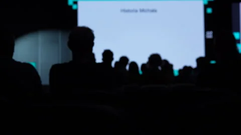 Silhouette Of Audience Watching Presentation At Technology Startup Conference Stock Footage 338010146