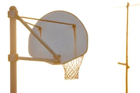 Silhouette of the back of a basketball backboard at sunset Stock Photos
