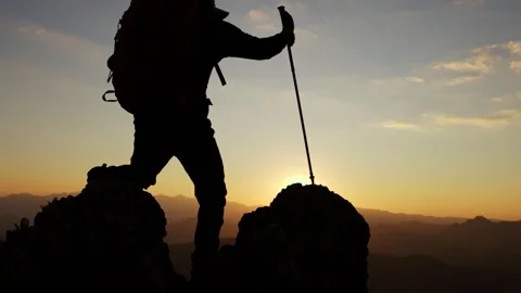 Silhouette of backpacker on mountain  and sun light background,business, su.. Stock Footage 336933460