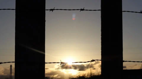 Silhouette of barbed wire and posts Stock Footage 38711147